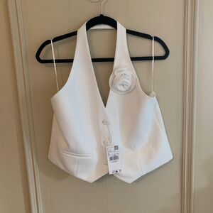New with Tags. Sexy ivory halter vest with flower (XL)